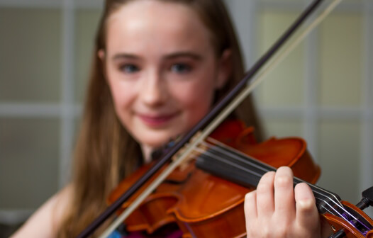 closeup of girl playing a violin