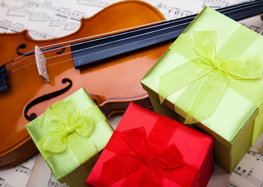 violin among gift boxes