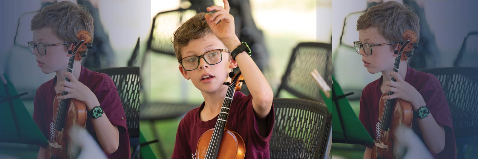 Young student holding a violin outdoors, raising a hand to signal a starting note