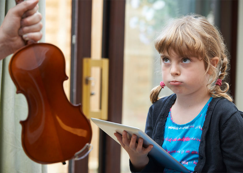 upset child shown a violin