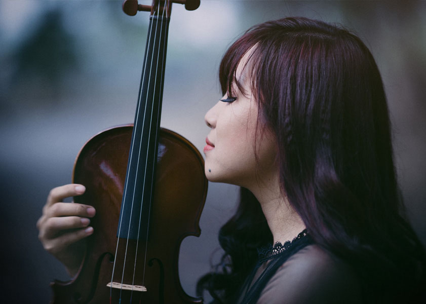 woman holding violin