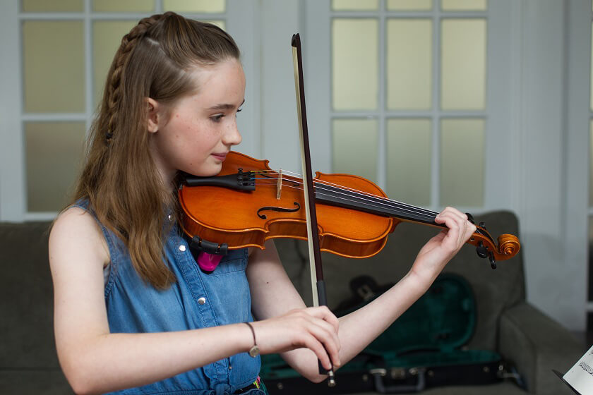 Young girl playing a violin