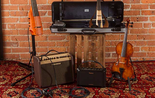 Assorted instruments plugged into amplifiers