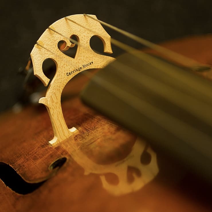 Cello bridge with Carriage House Violins logo