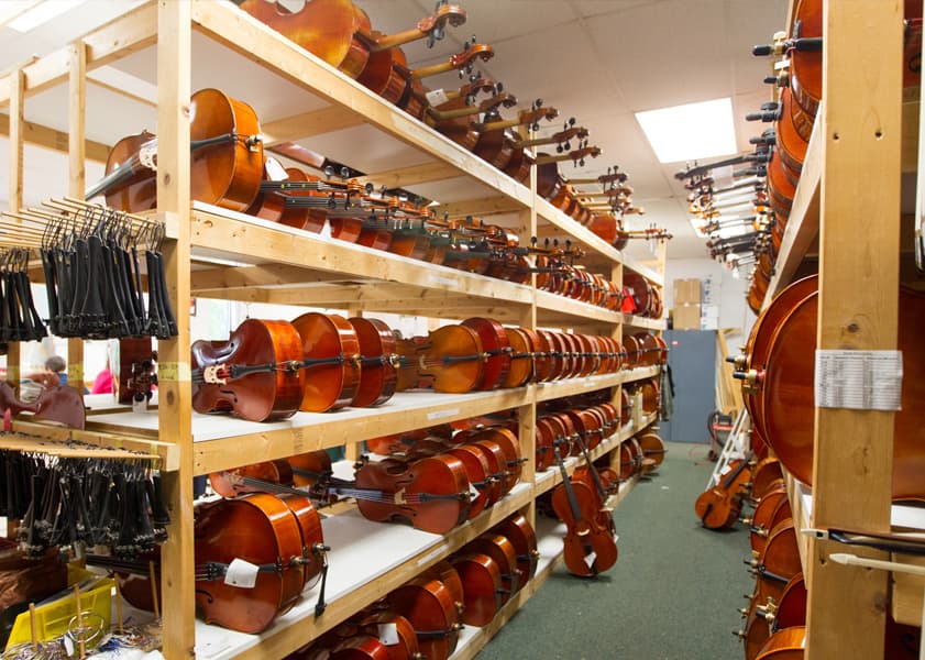 violins on wooden racks