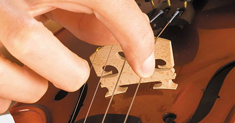 person plucking violin strings