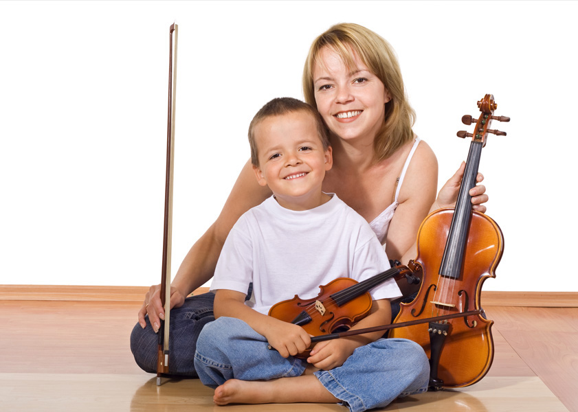 woman and child posing with violins