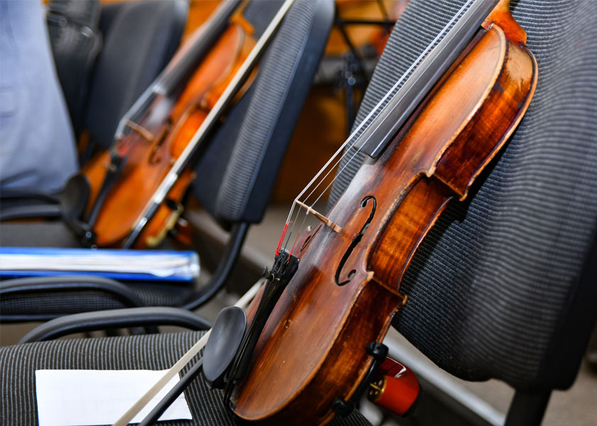 violin placed on a chair